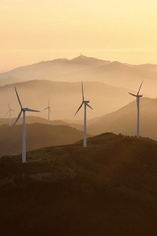 A group of wind turbines on a hill