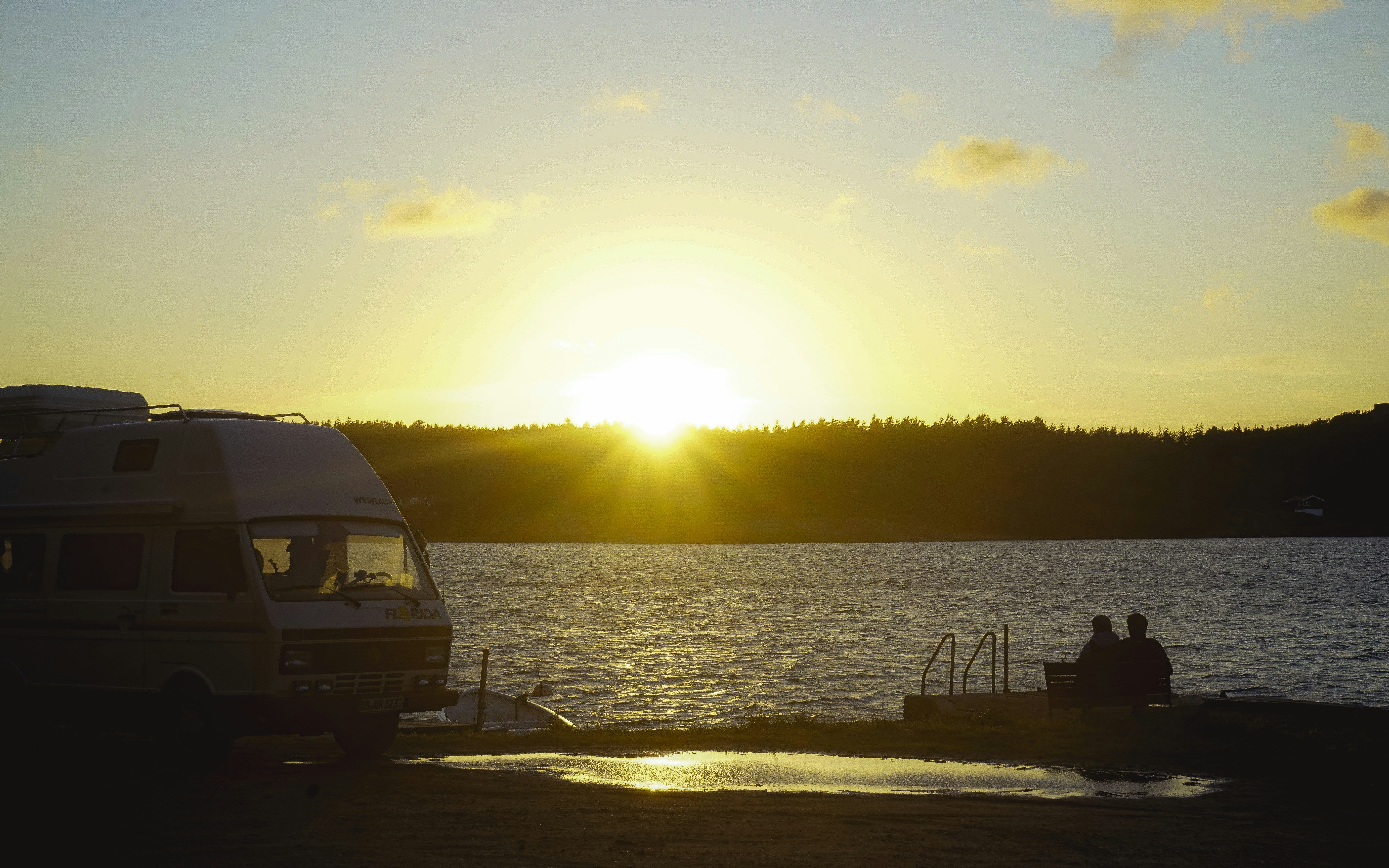 couple camping van sunset