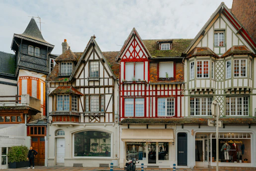 A row of multicolored buildings sitting next to each other