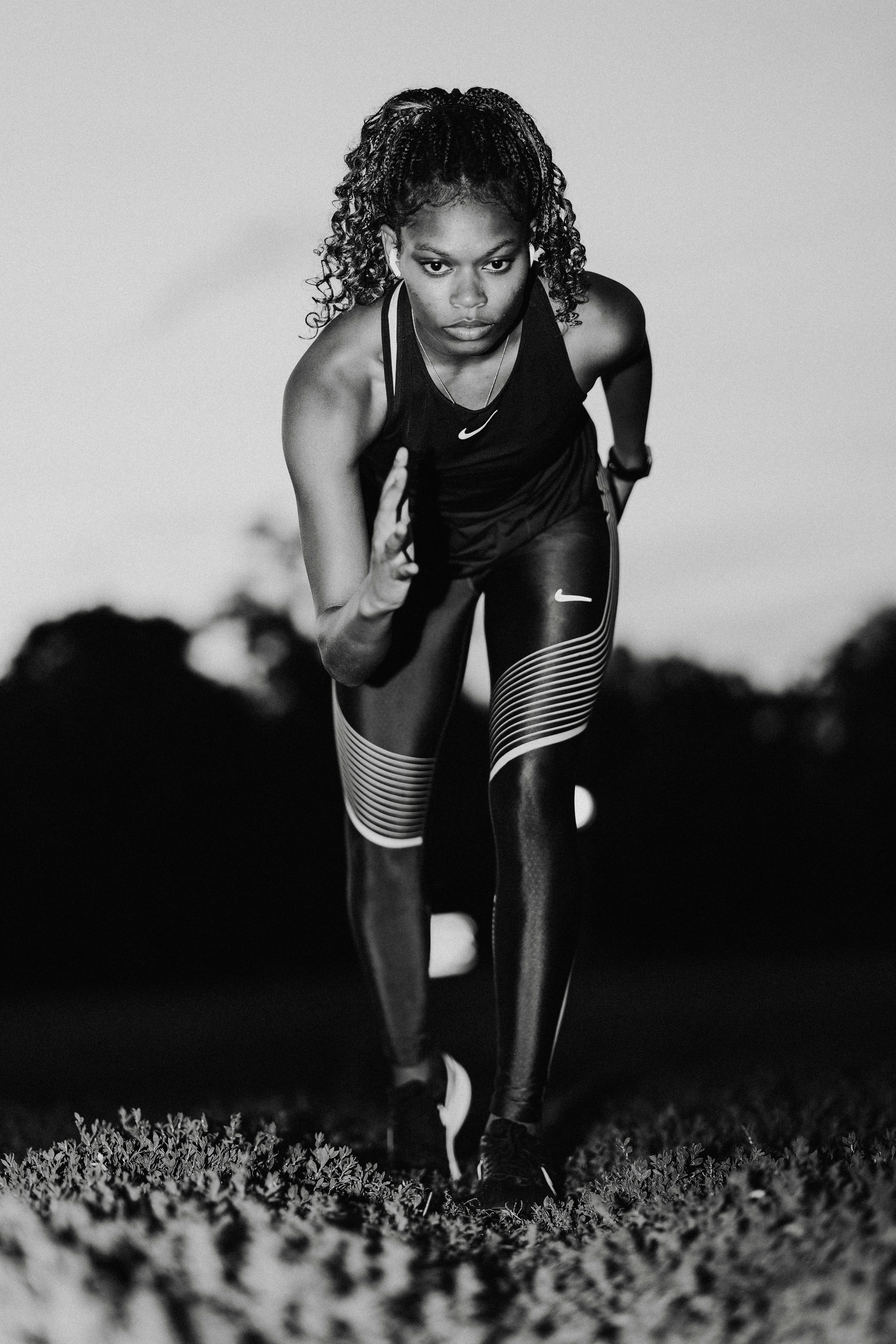 A black and white photo of a woman running