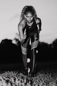 A black and white photo of a woman running