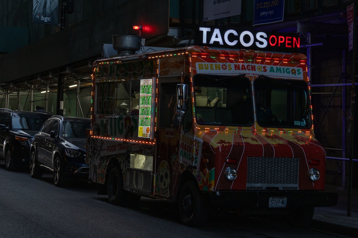 A taco truck parked on the side of the road