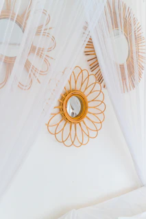 A bed with a canopy and a mirror on the wall