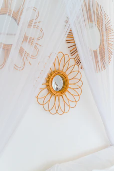 A bed with a canopy and a mirror on the wall