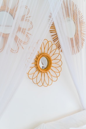 A bed with a canopy and a mirror on the wall