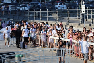 A crowd of people standing next to each other
