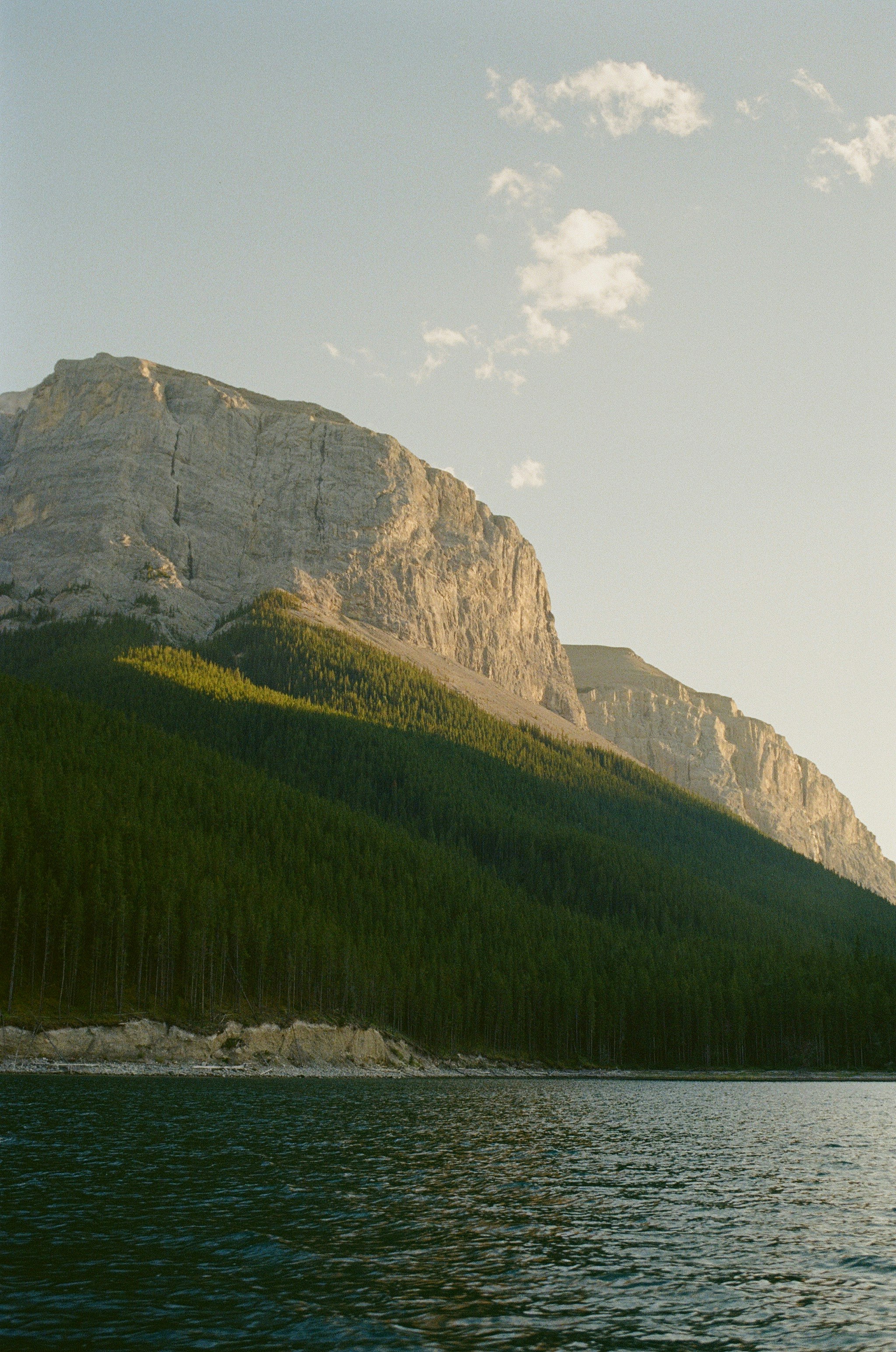 A lake with a mountain in the background