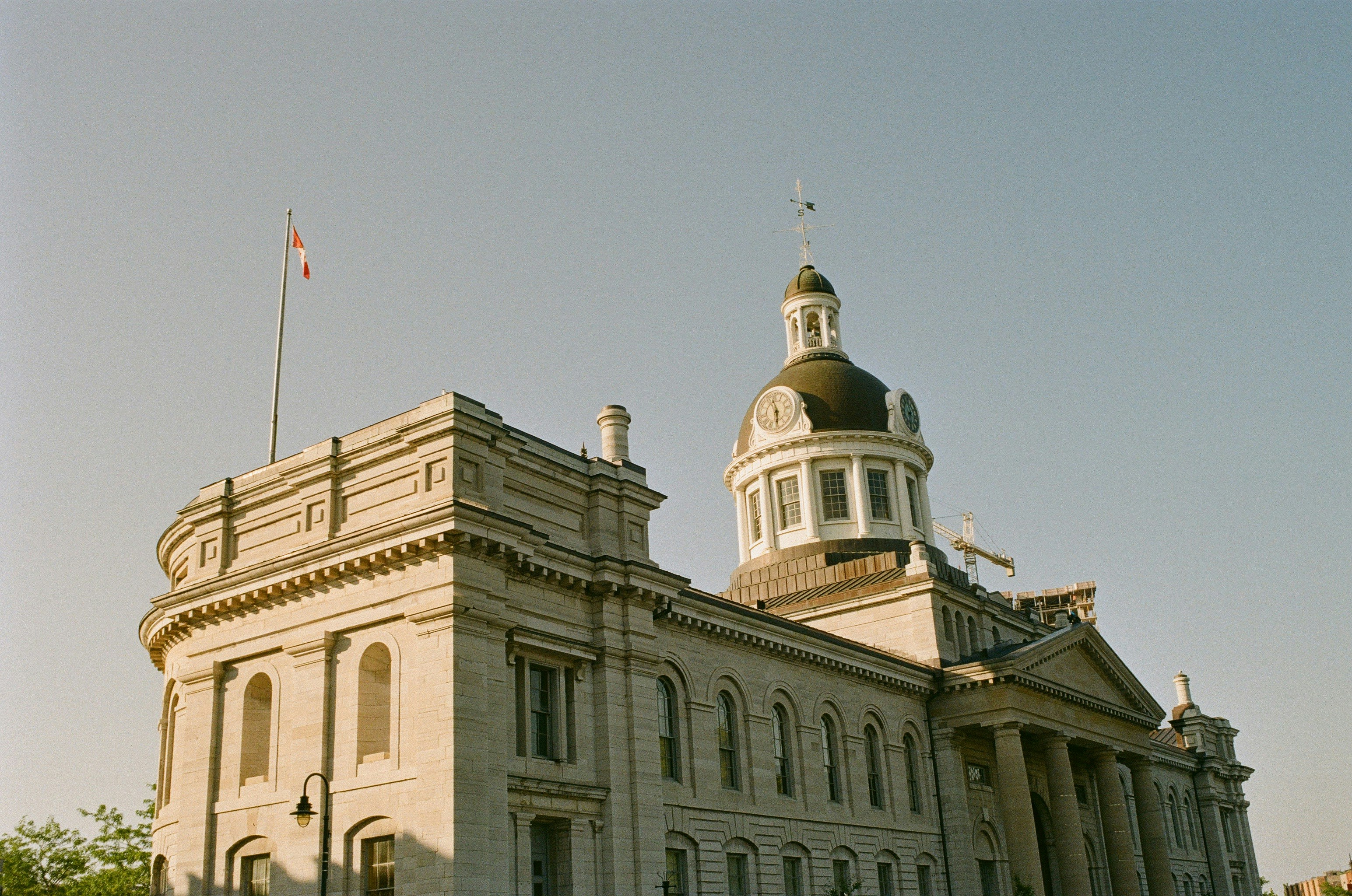 A large building with a clock tower on top of it photo – Free Building ...
