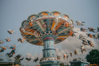 A carnival ride with people riding on it