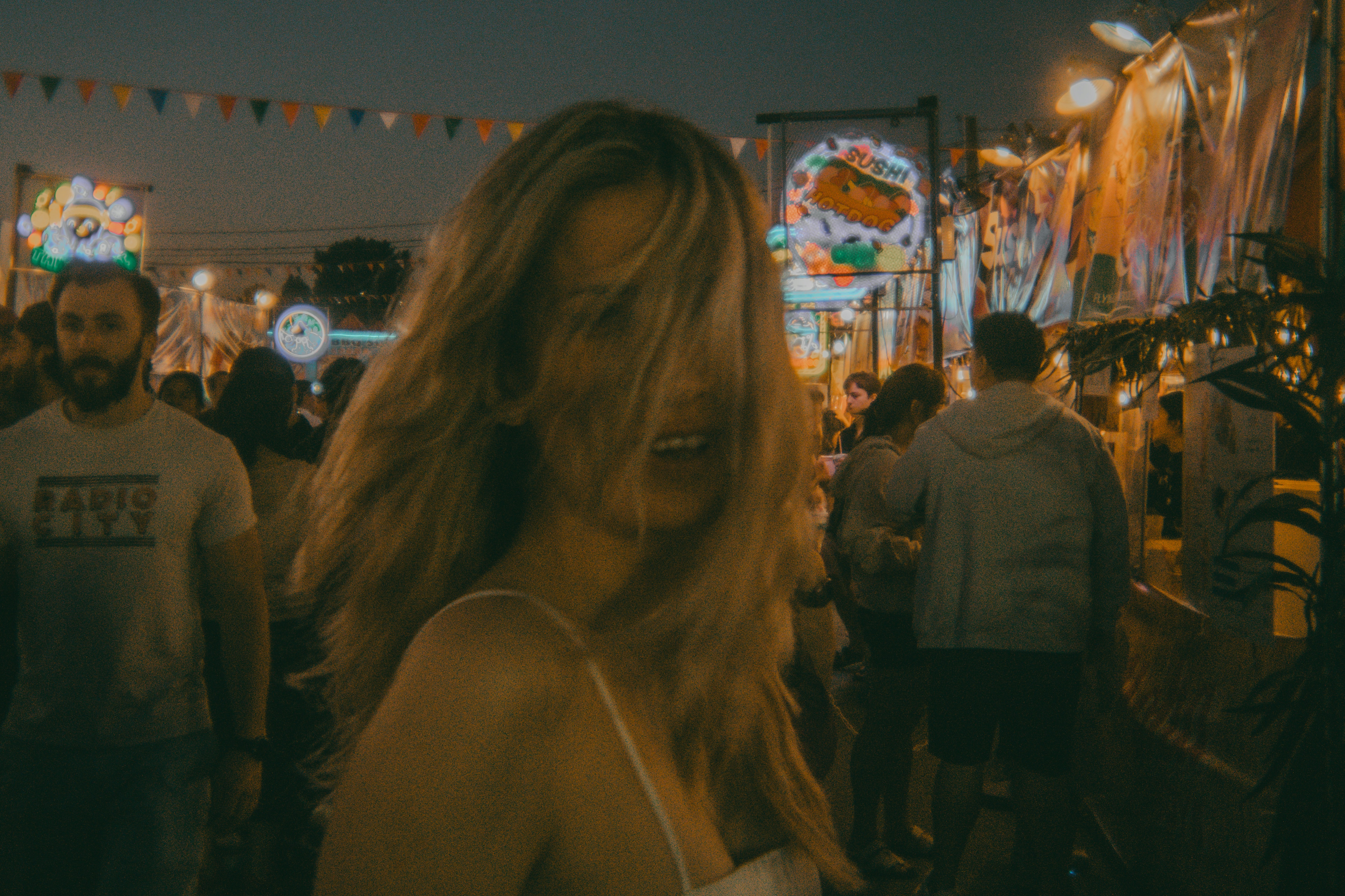 A woman standing in front of a crowd of people