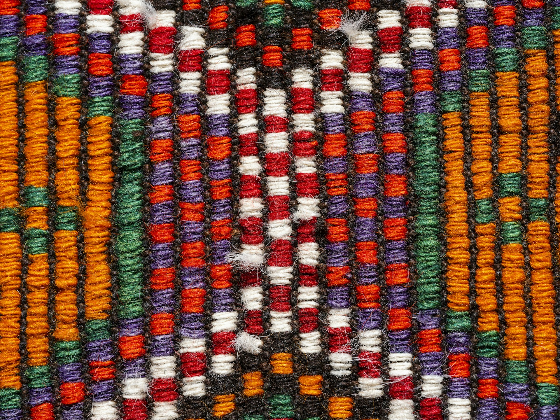 A close up of a multicolored woven material