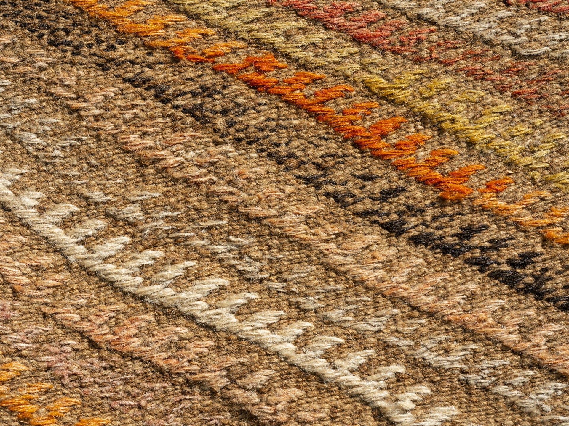 A close up of a multi colored rug