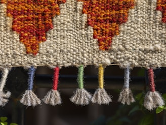A close up of a piece of cloth with tassels