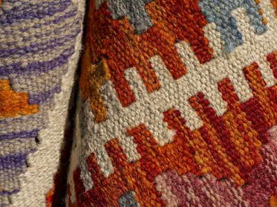 A close up of a colorful knitted tie