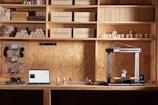 A desk with a laptop on it in a room