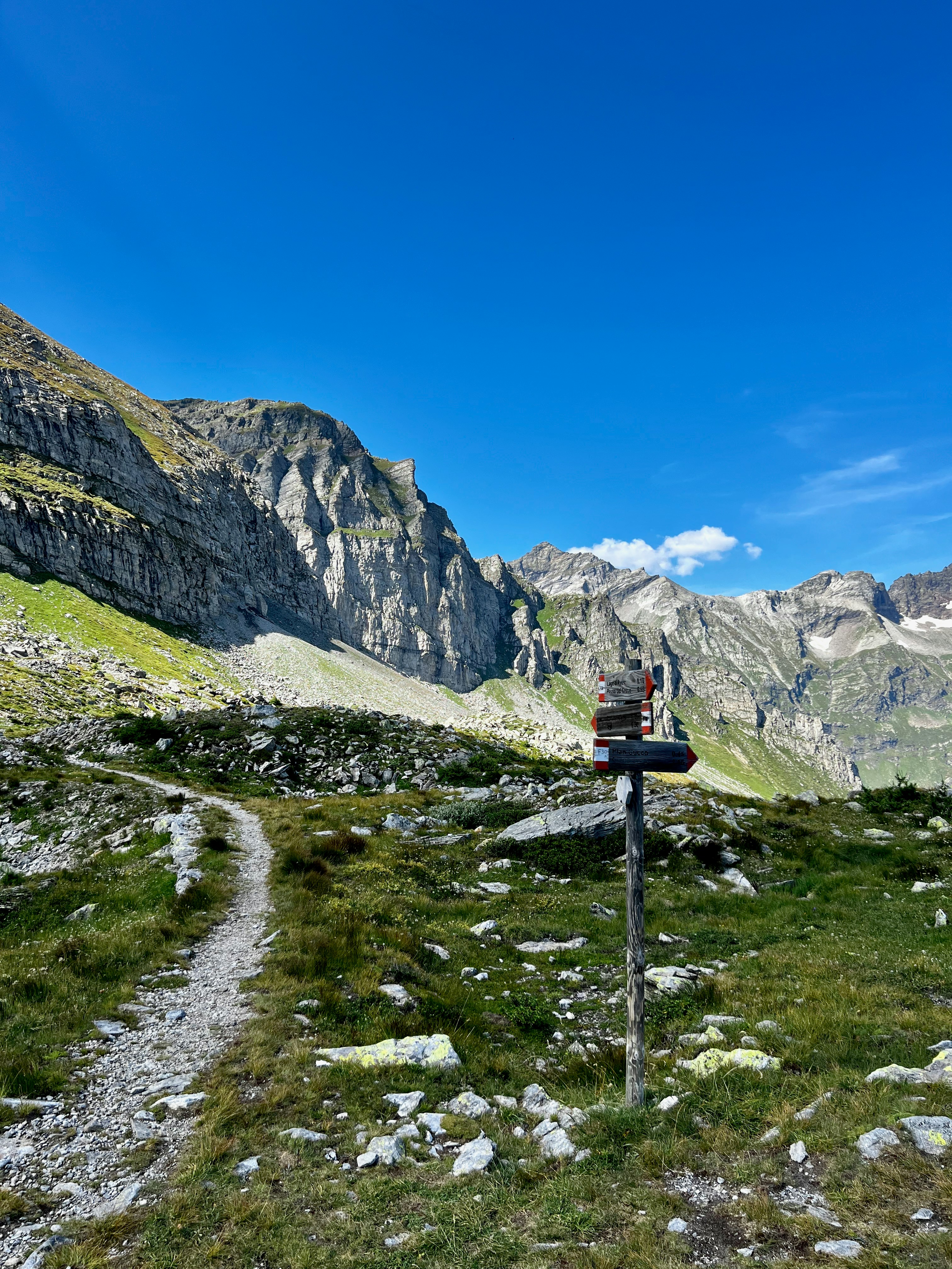 A trail in the mountains with a sky background