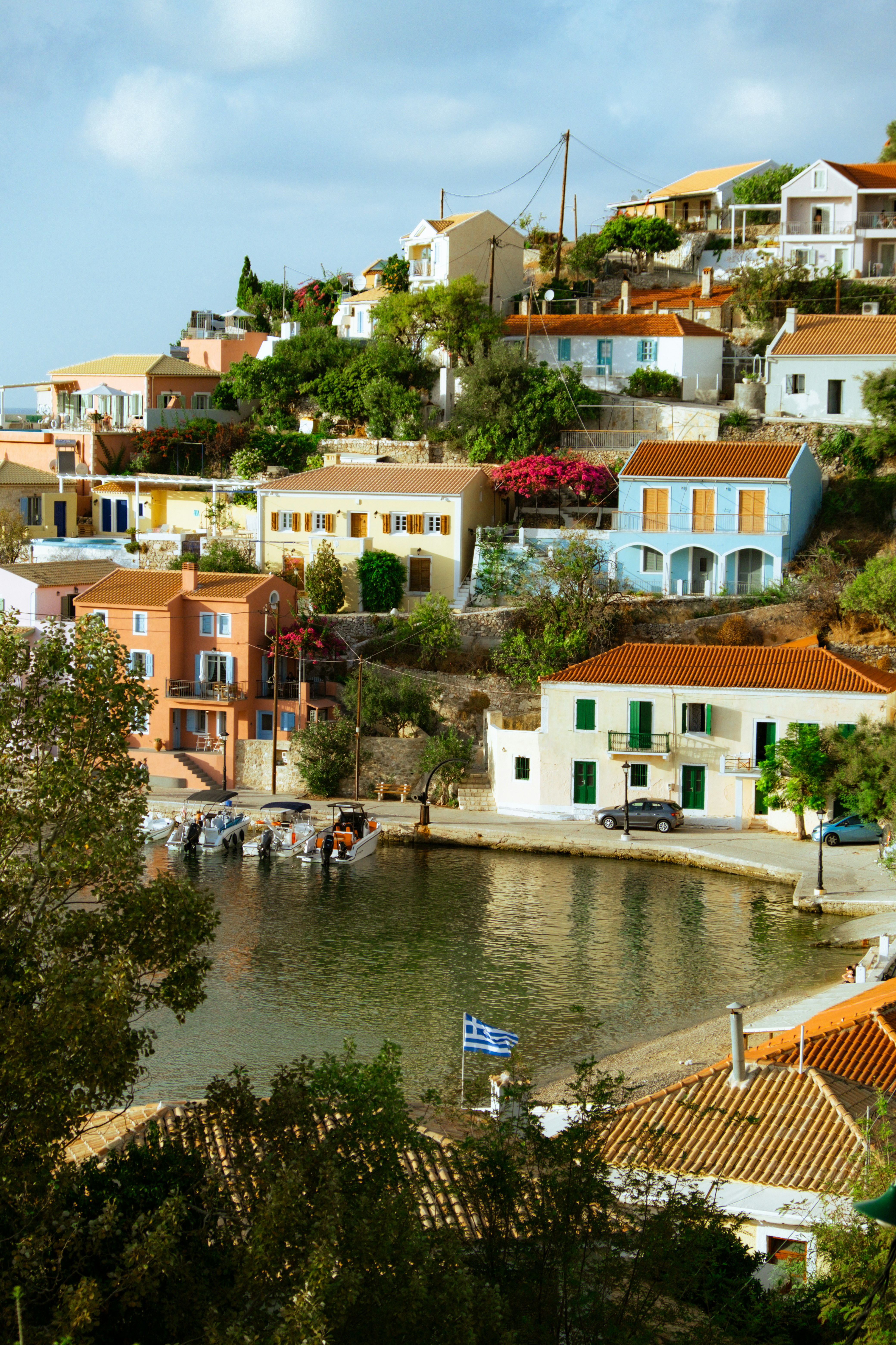 A small village on a hill overlooking a body of water
