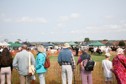 A group of people standing next to each other near a fence