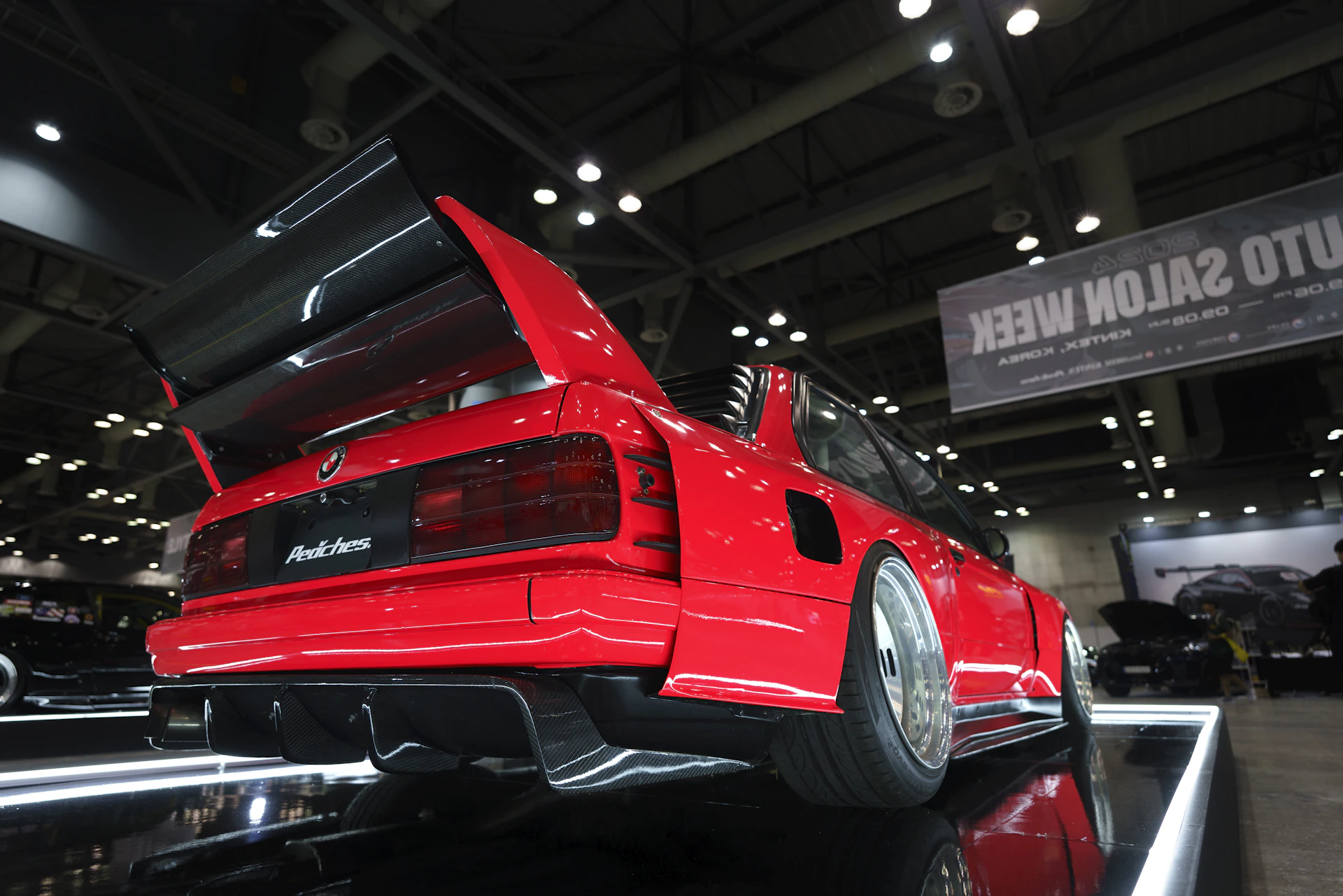 A red car on display at a car show