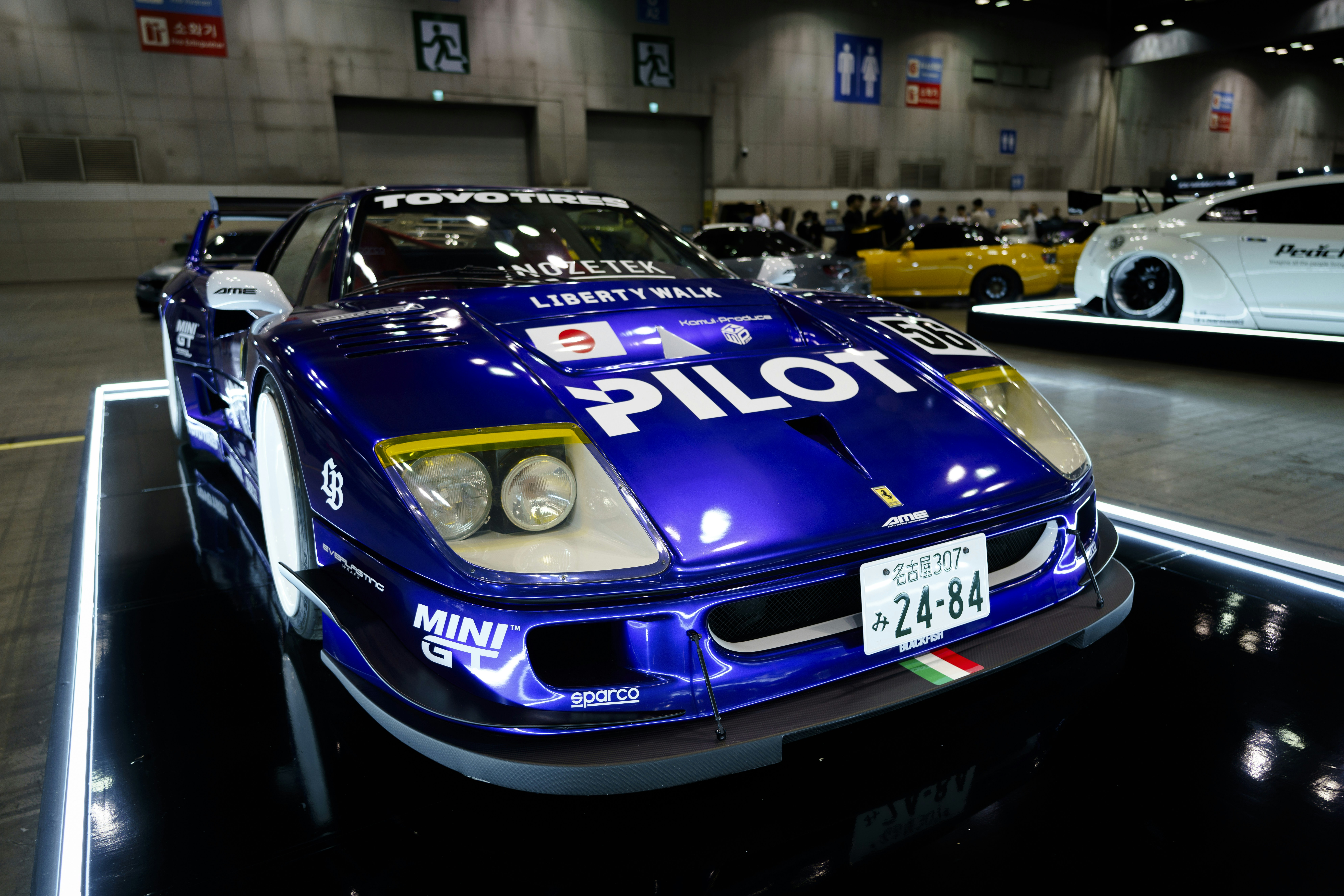 A group of cars parked in a parking garage