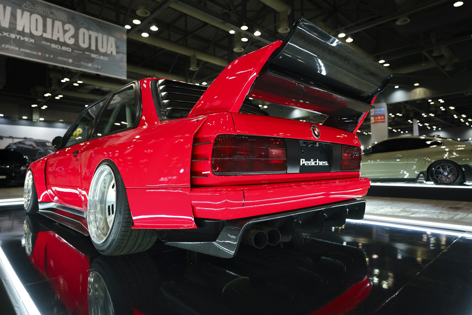 A red car on display at a car show