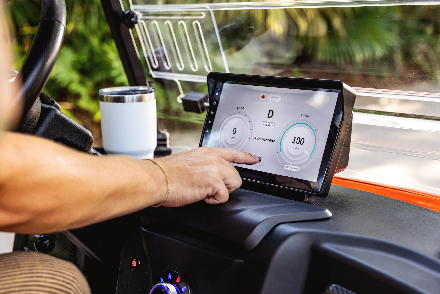 Commercial driver reviewing information on a digital screen inside a truck