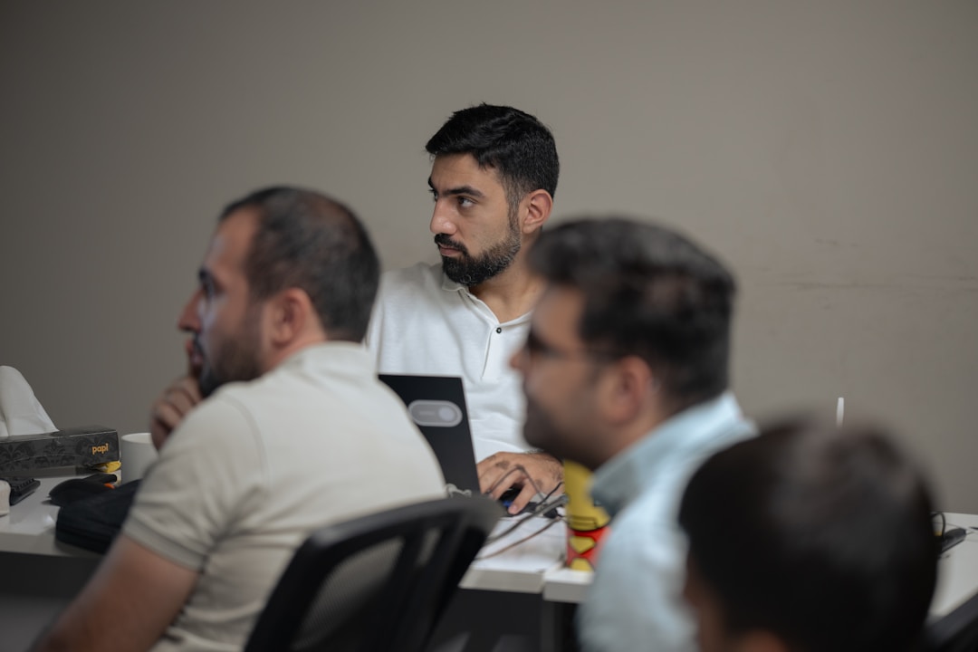 Team members utilizing nonprofit texting to enhance donor engagement through SMS campaigns