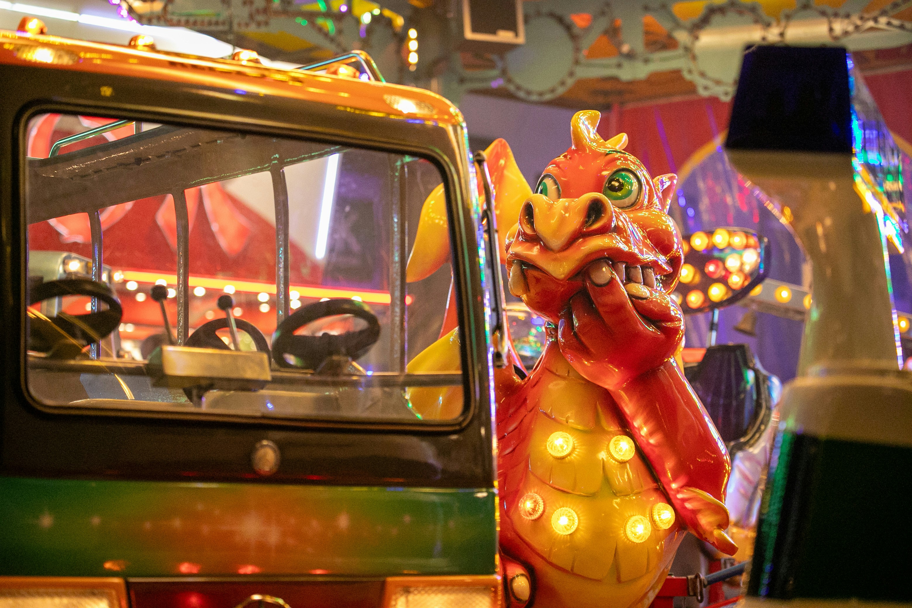 A dragon statue next to a bus in a carnival photo – Free Soest Image on ...