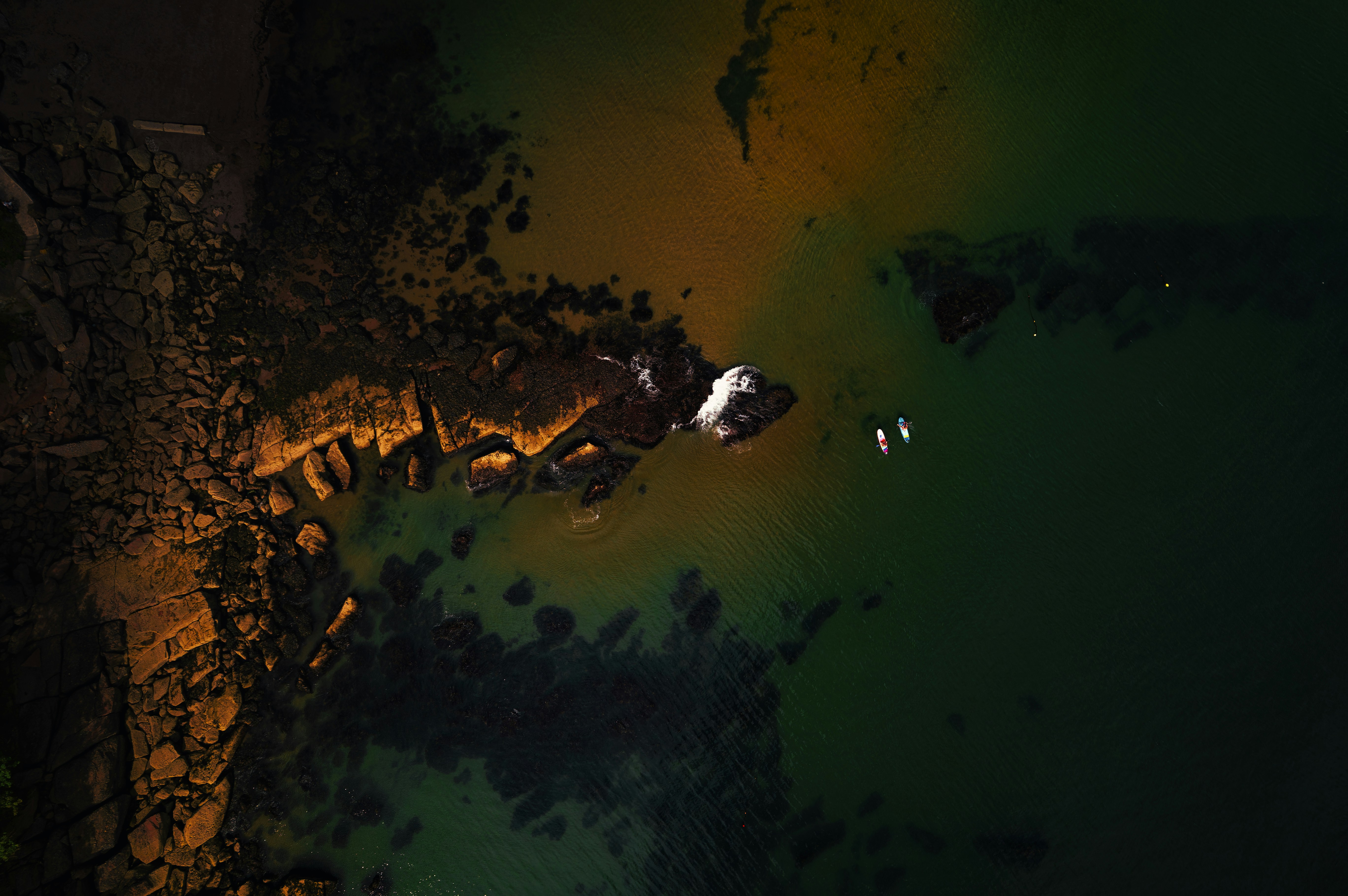 An aerial view of a body of water at night