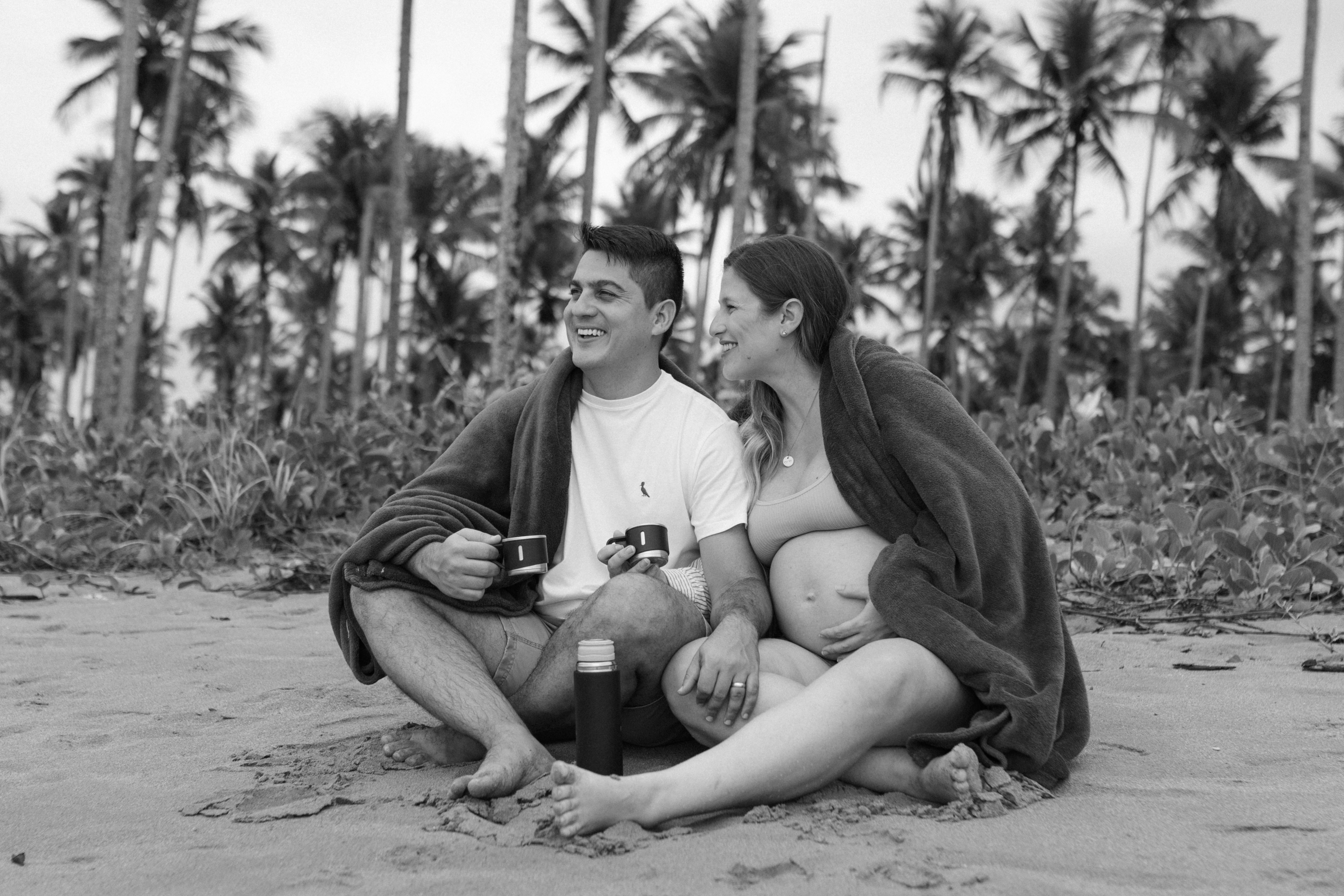 Couple on beach with palm trees