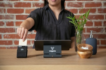 A man sitting at a table with a laptop