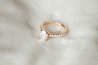 A close up of a ring on a white cloth