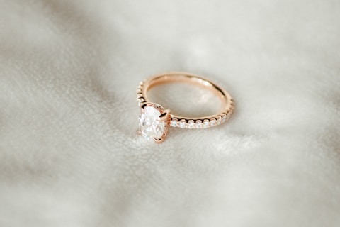 A close up of a ring on a white cloth