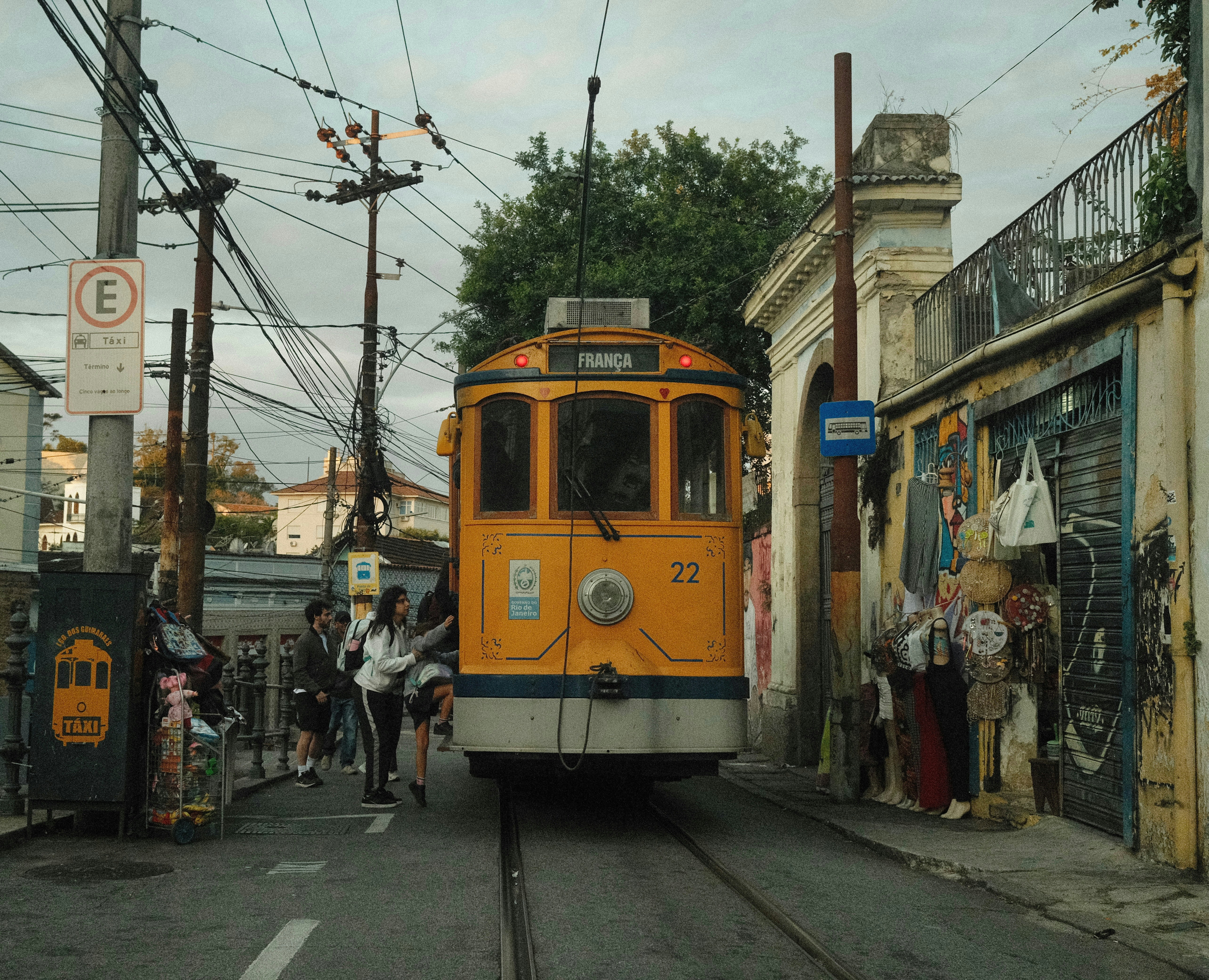 a person stepping off a CTA train into a vibrant neighborhood street scene - Apartments close to CTA