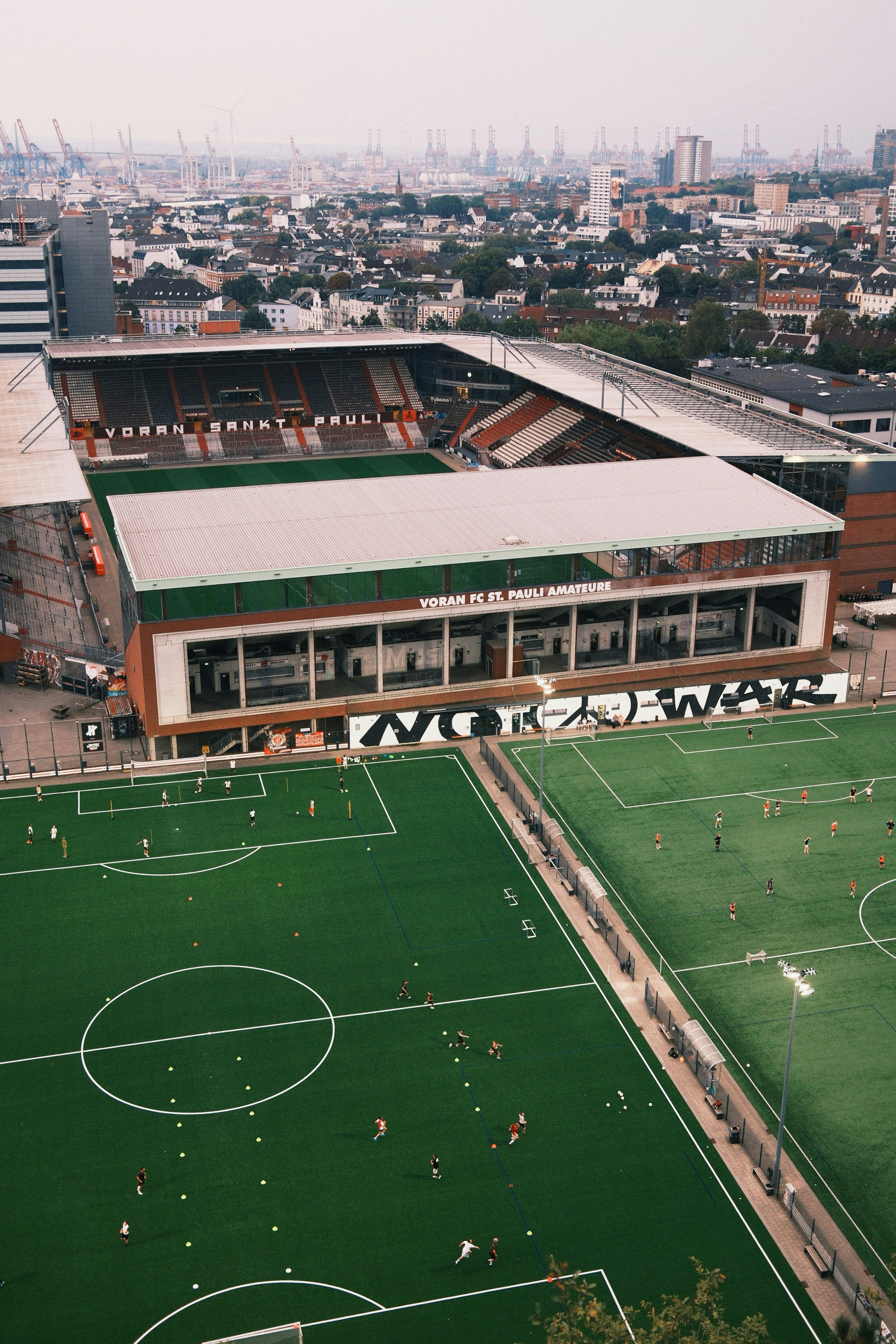 An aerial view of a soccer field in a city
