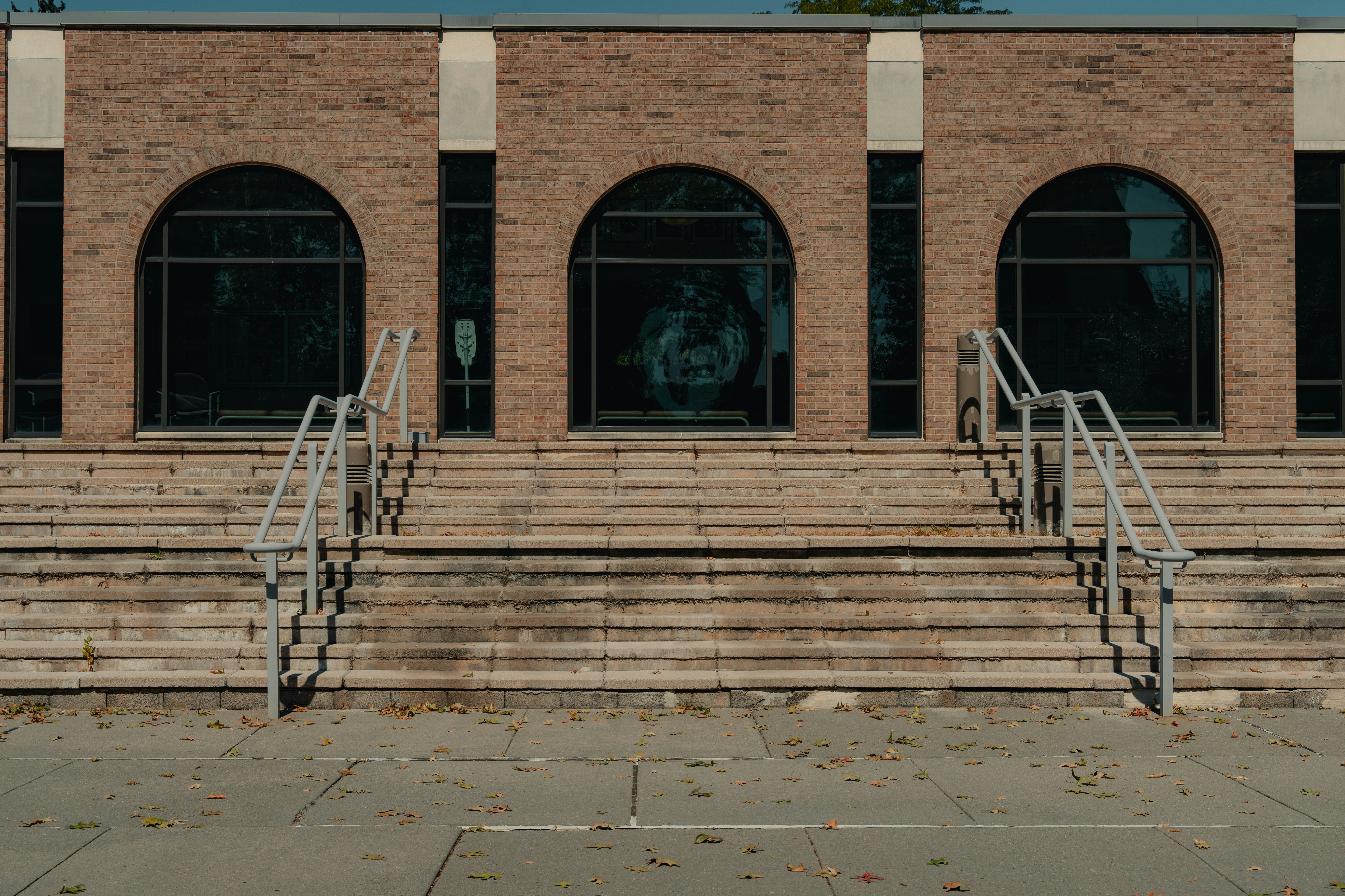 A brick building with steps leading up to it photo – Free Building ...