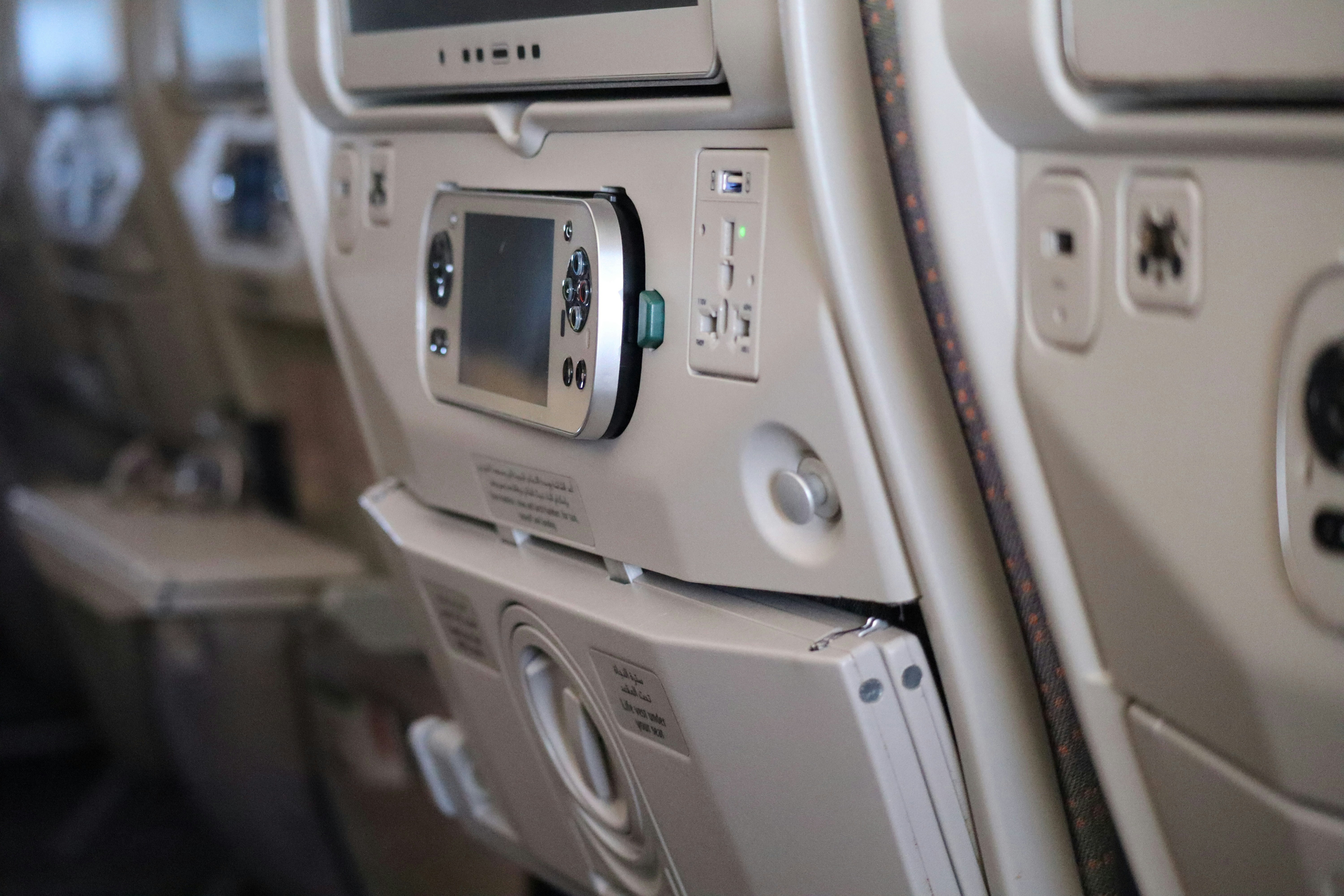 A row of seats with electronic devices on them
