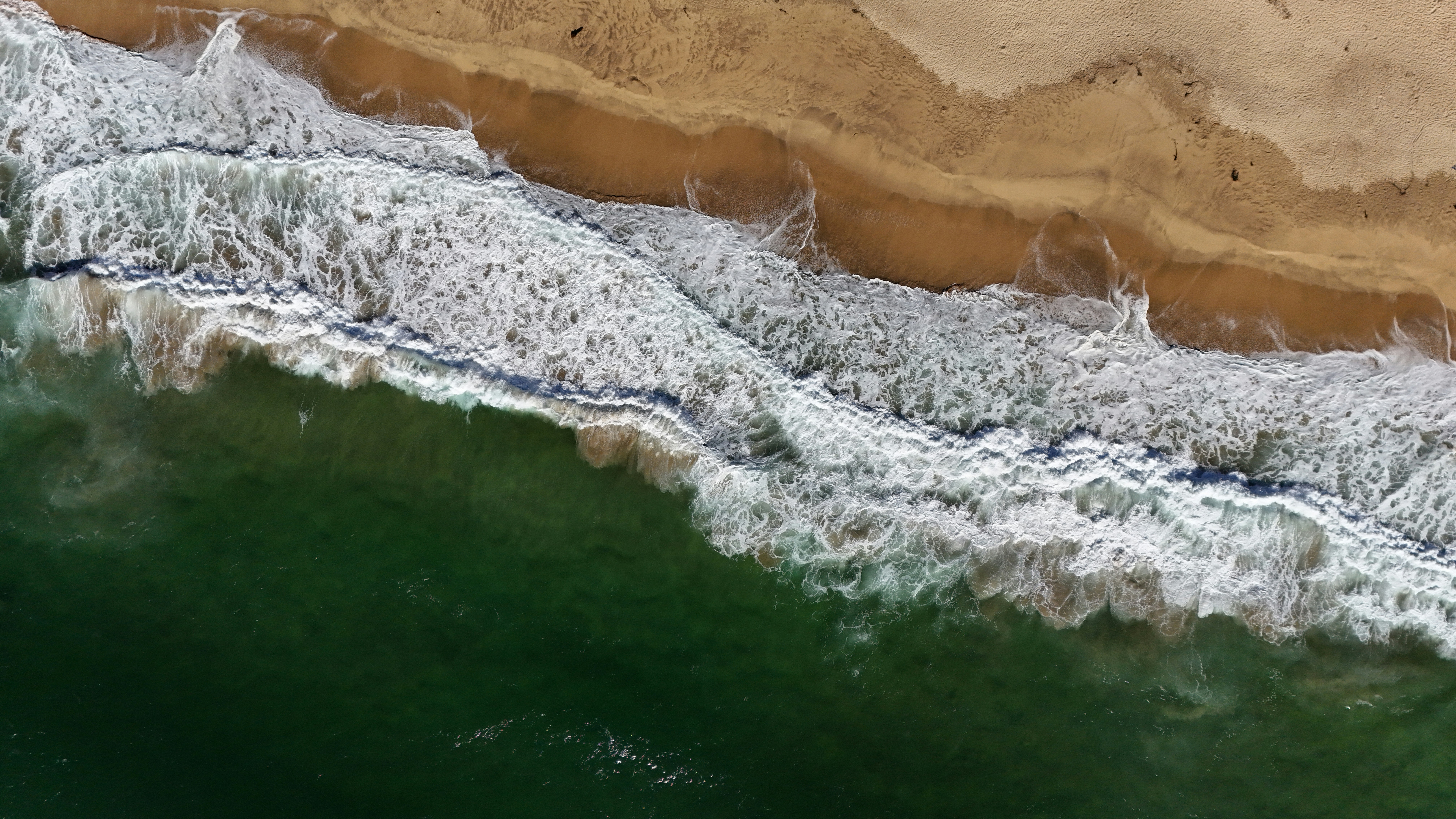 A bird's eye view of a beach and ocean