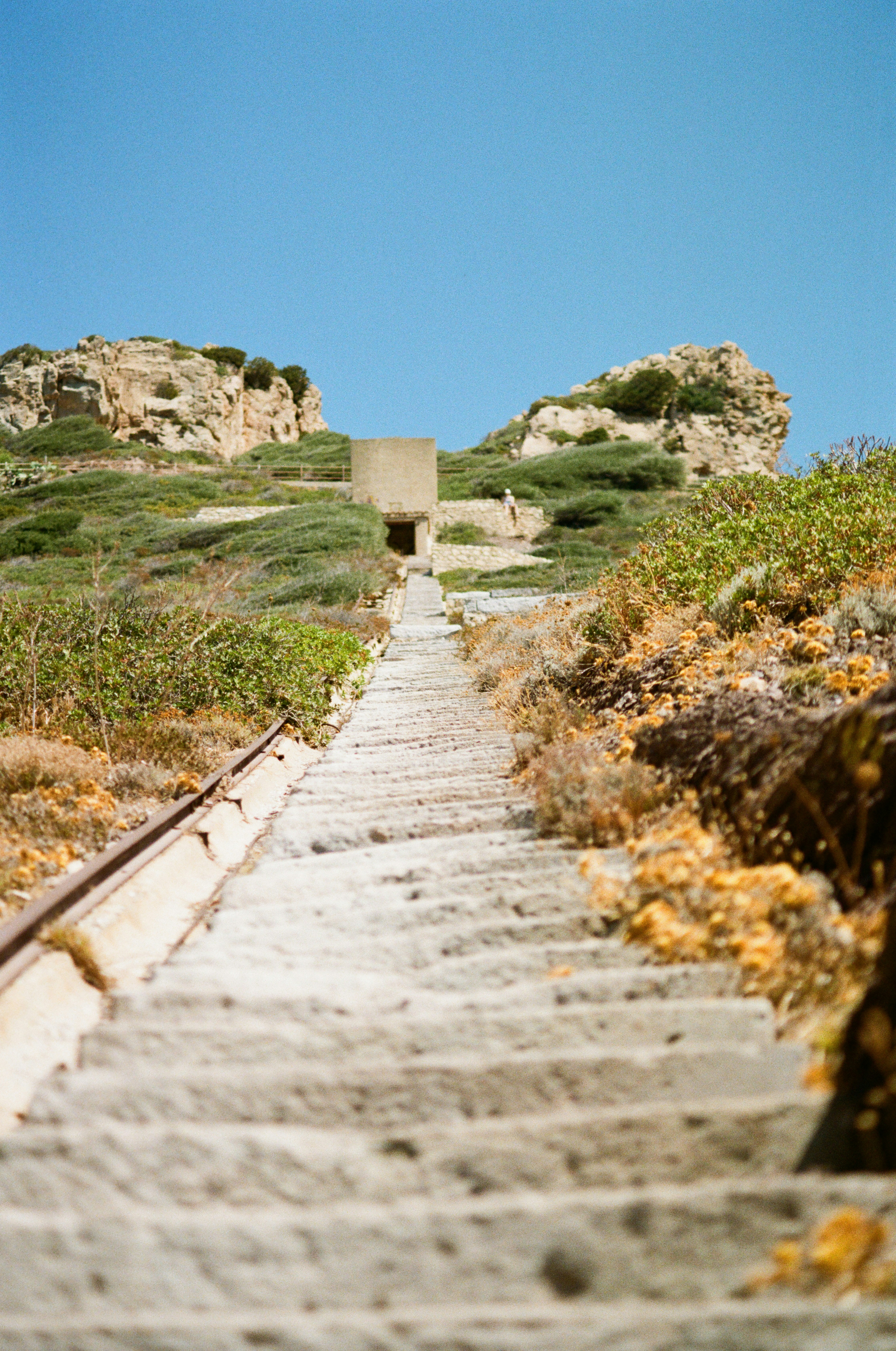 A set of stairs leading up to the top of a hill