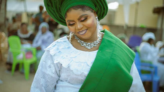 A woman in a green and white outfit