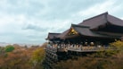 A building on a hill with people standing on it