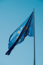A european flag flying high in the sky