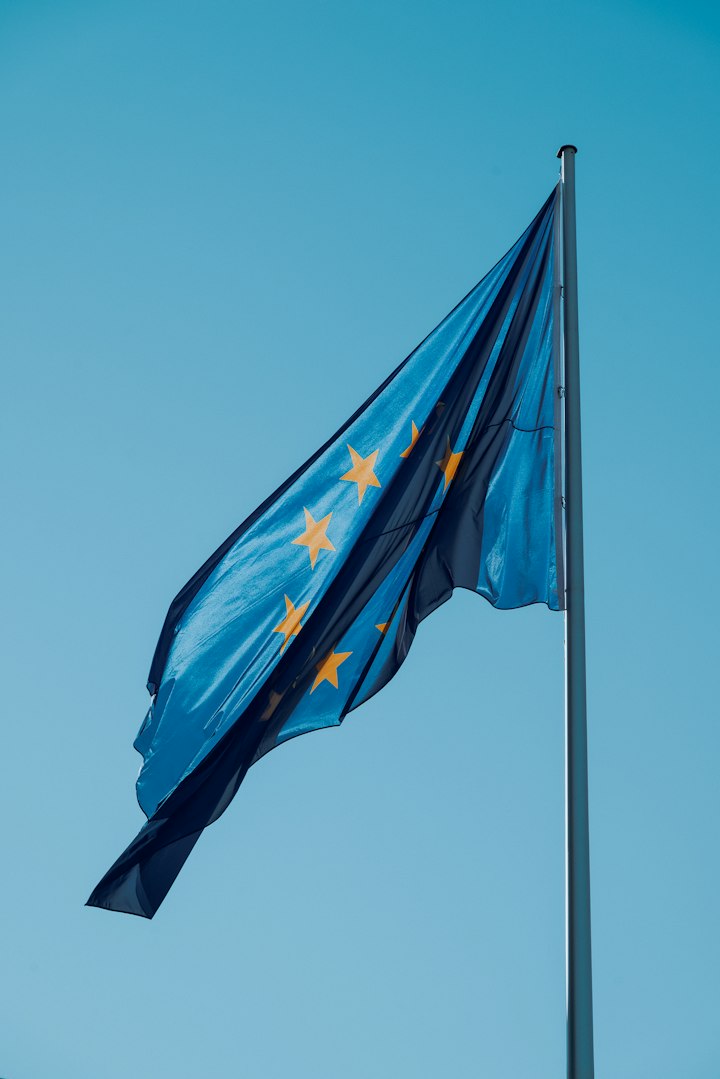 European Union flag flying against a blue sky