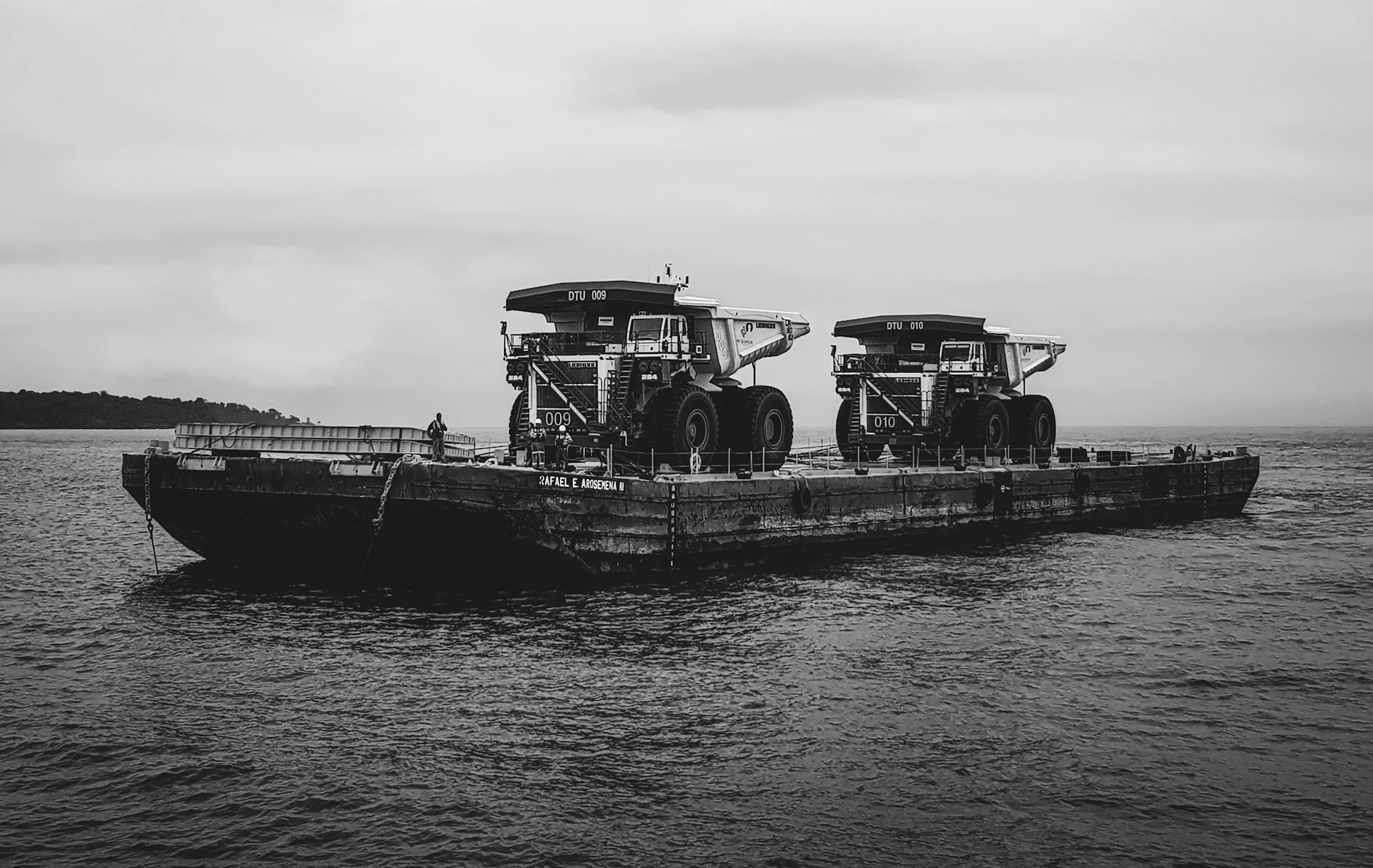 A black and white photo of a boat in the water