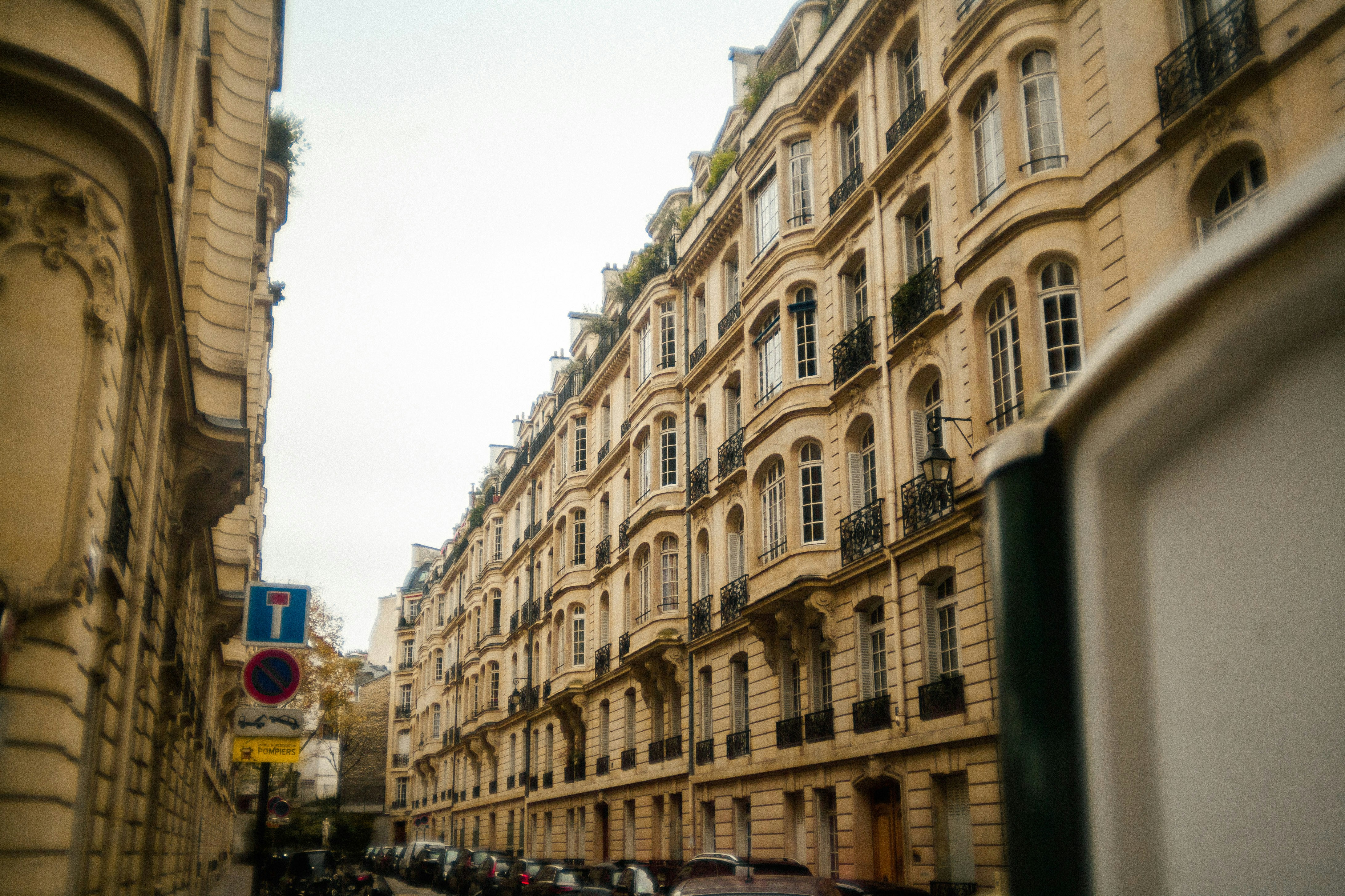 A city street filled with lots of tall buildings