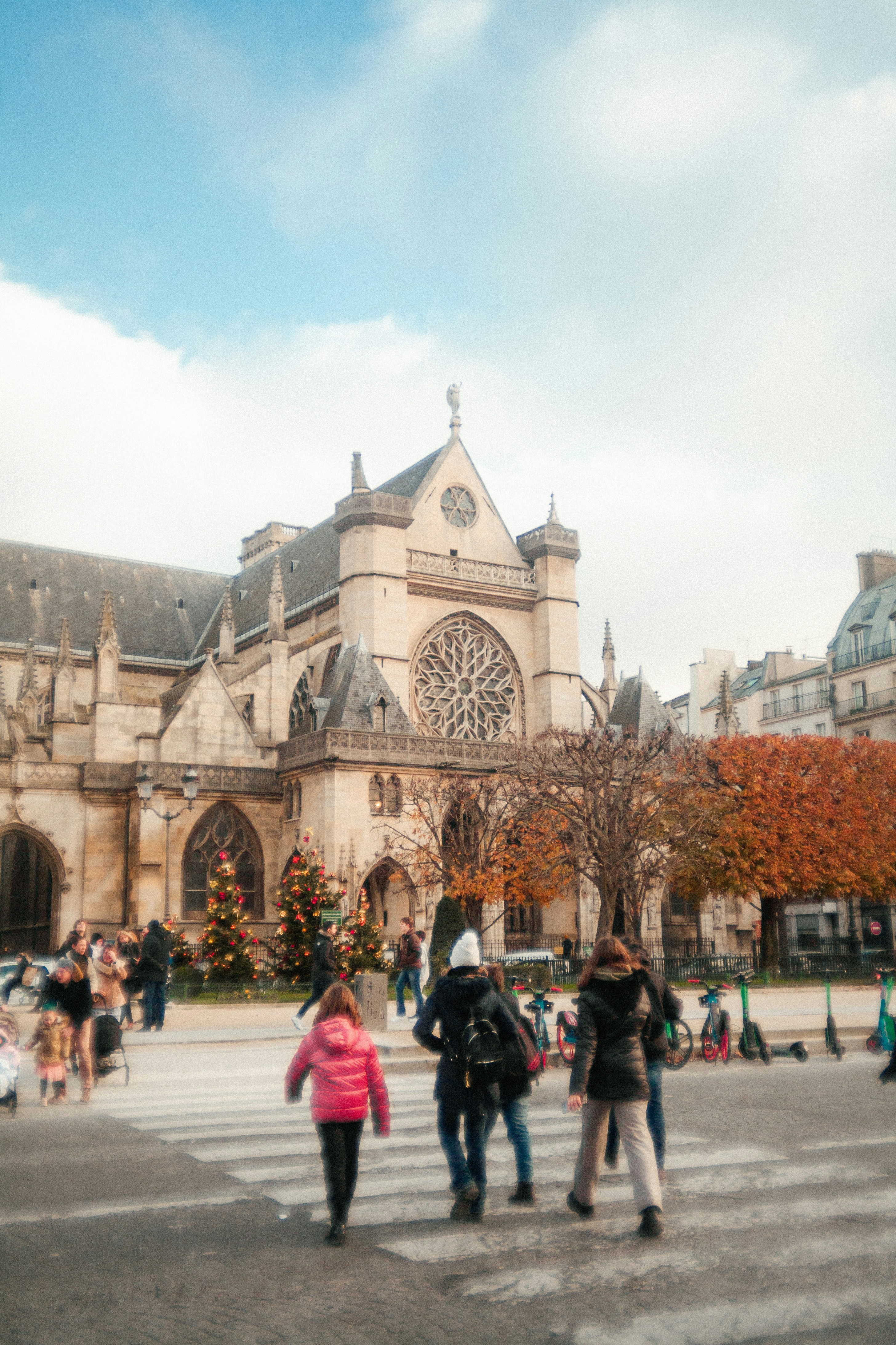 A group of people standing in front of a large building
