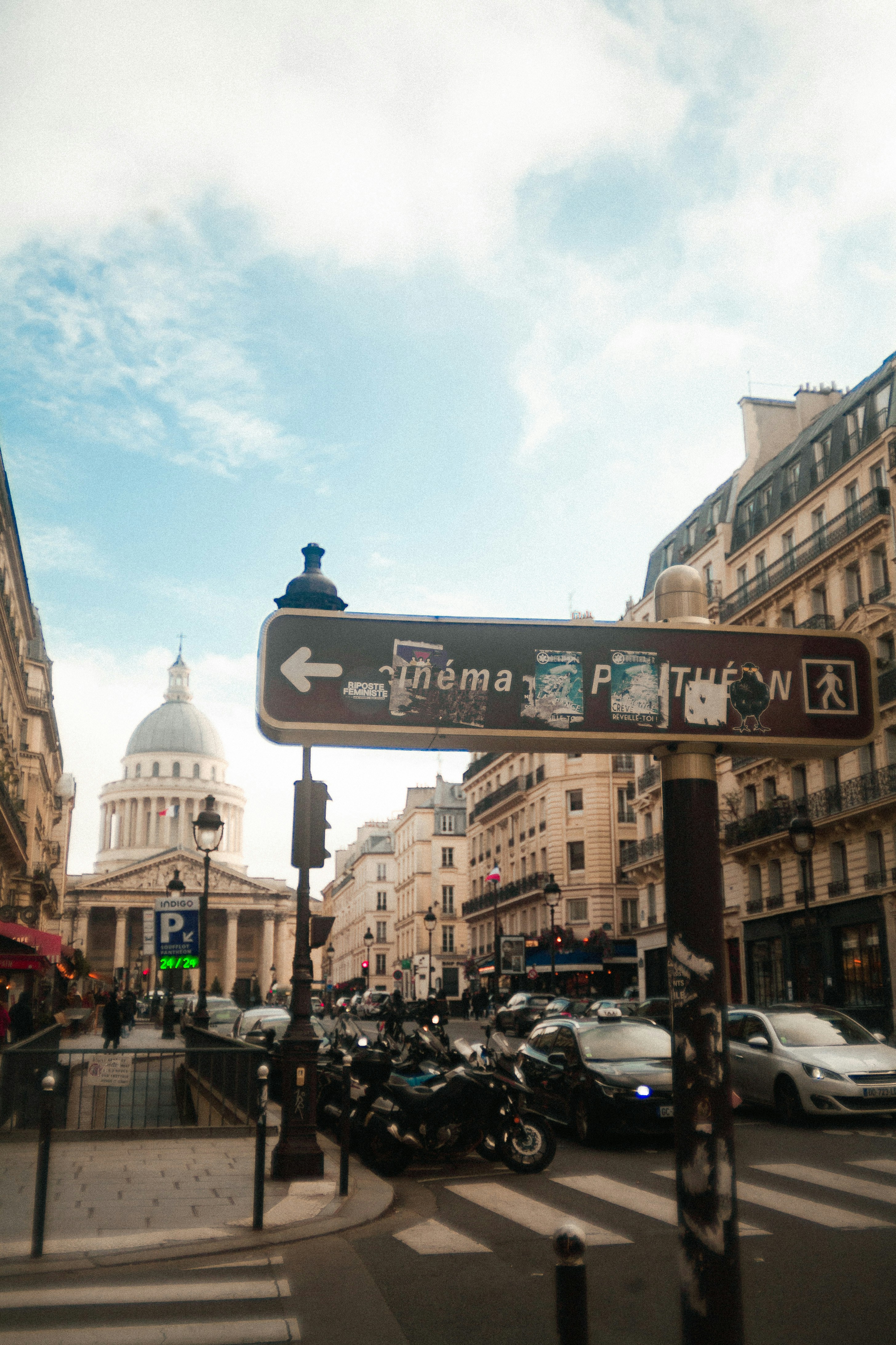 A street sign on a pole in a city