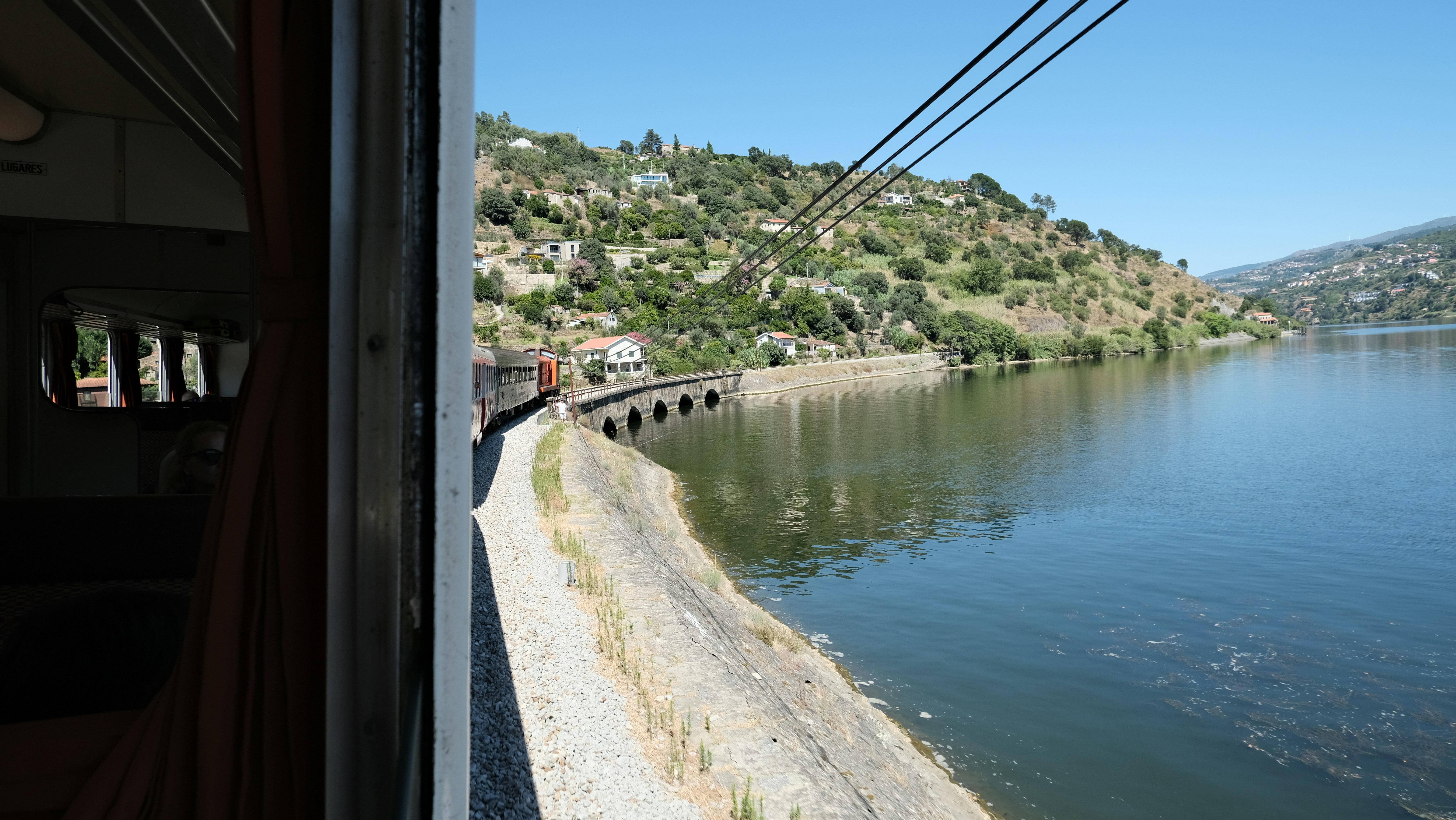 A view of a body of water from a train, 
