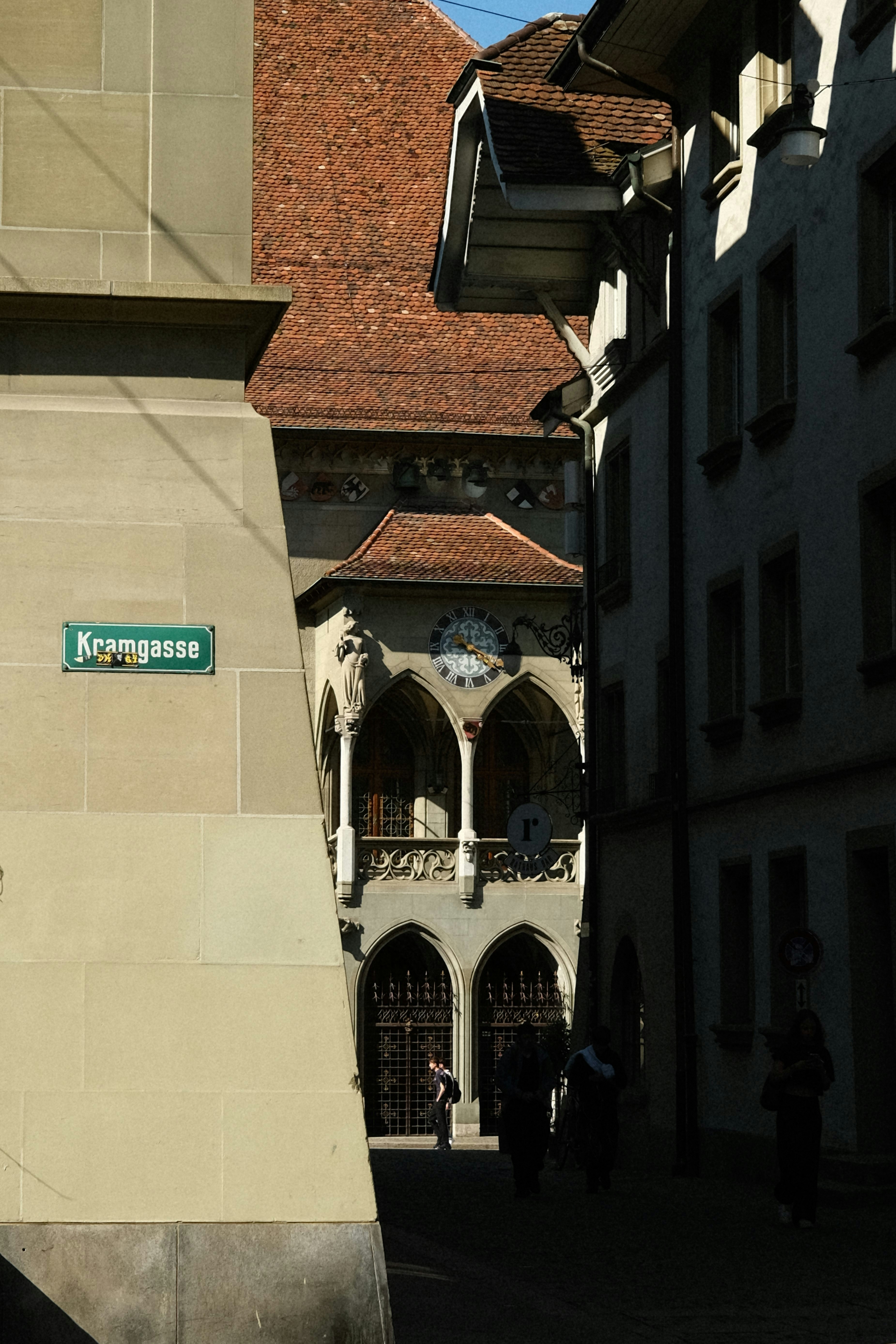 A clock tower in the middle of a city
