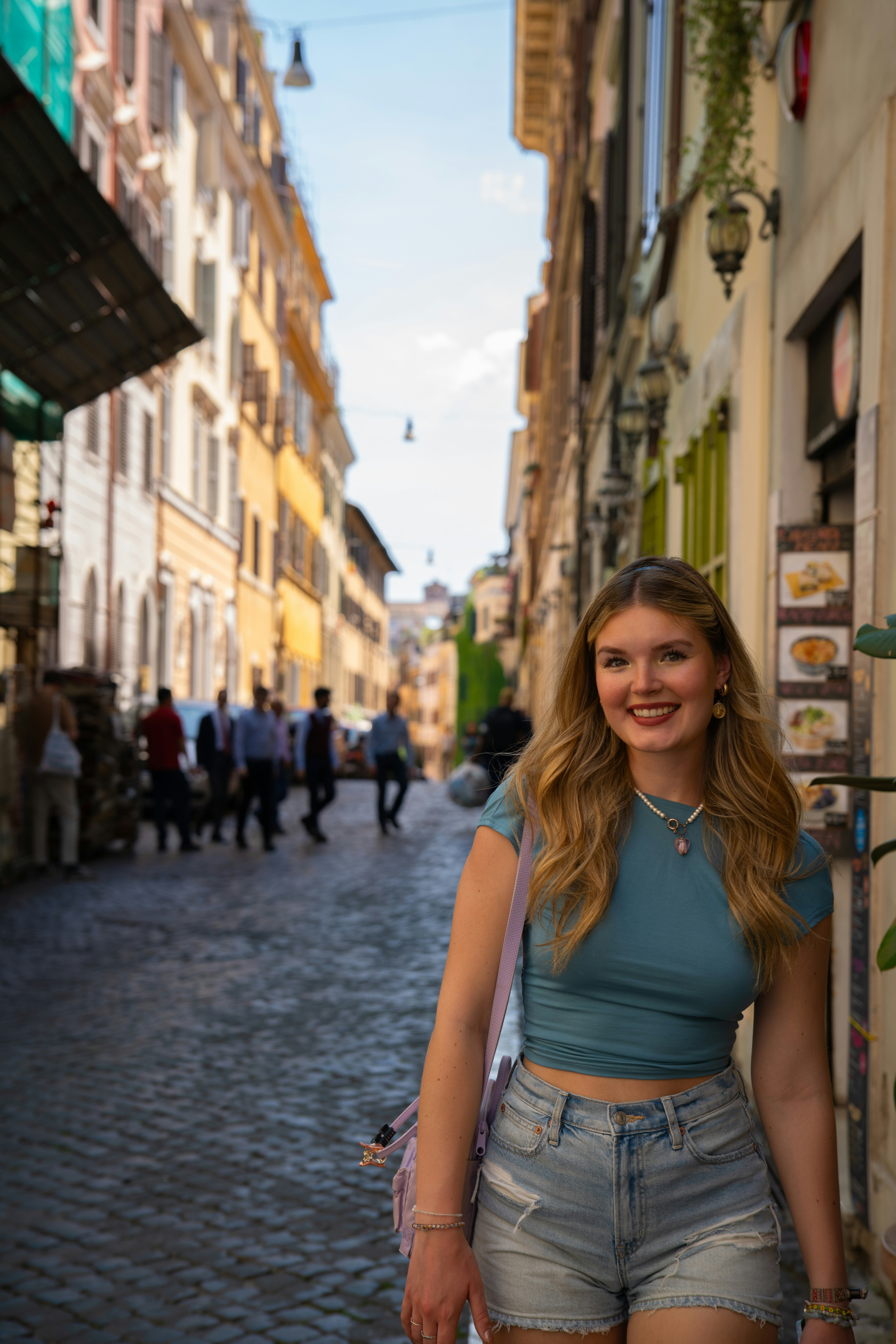 A woman standing in the middle of a street